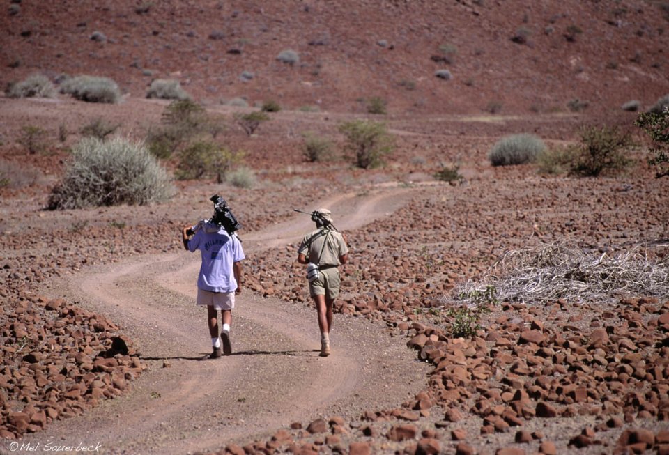 Photographers walking track in Namibia